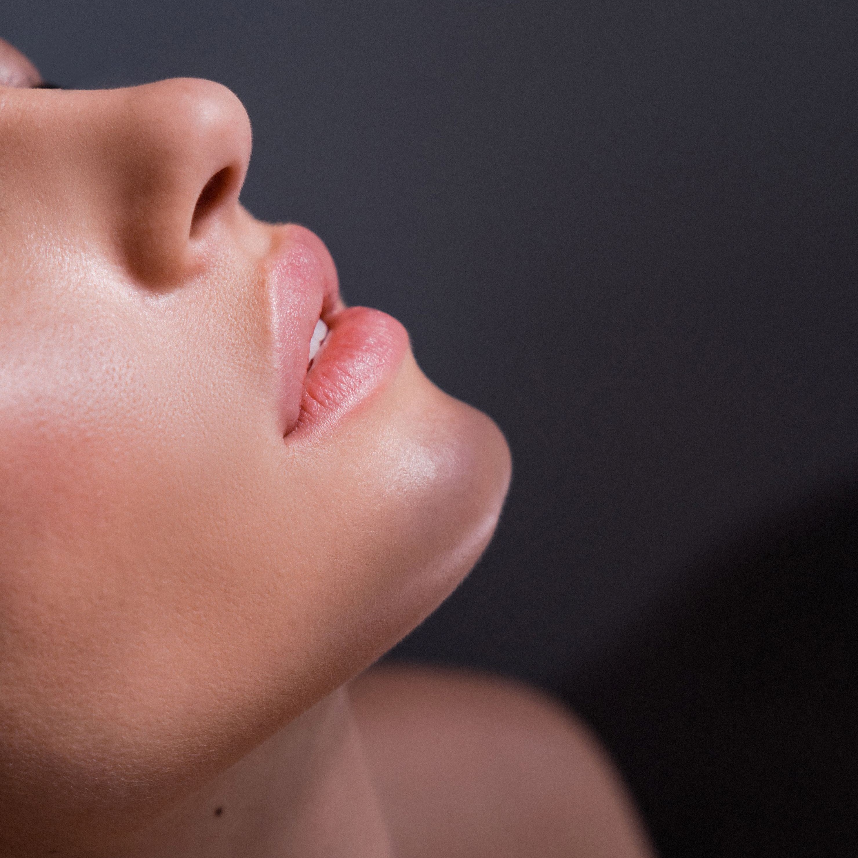 Natural close-up portrait showing realistic skin texture