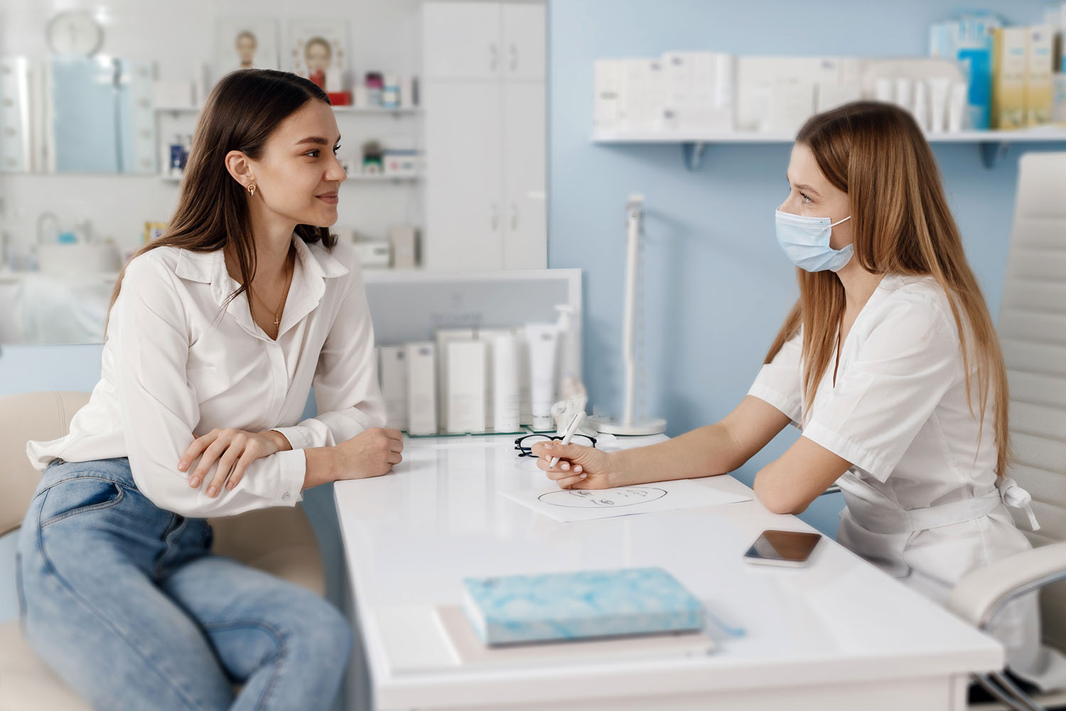 Dermatologist carefully examining a patient's skin